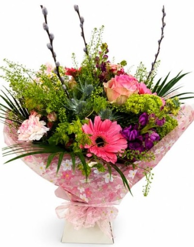 Pink Cocktail - A beautifully hand-tied bouquet in soft pink, purple and fresh green tones, designed to bring warmth, colour and a heartfelt touch to any special occasion.